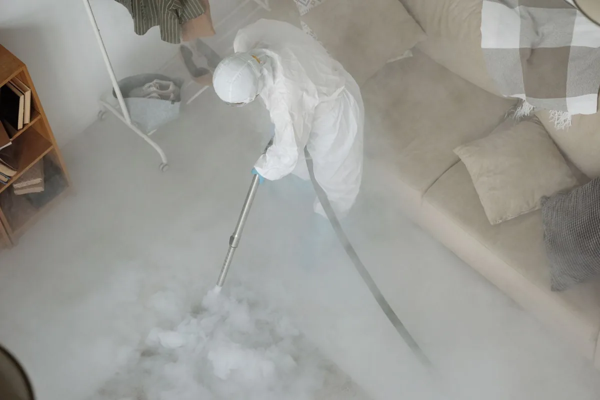 Biohazard cleanup technician in protective equipment, Ripley, MS
